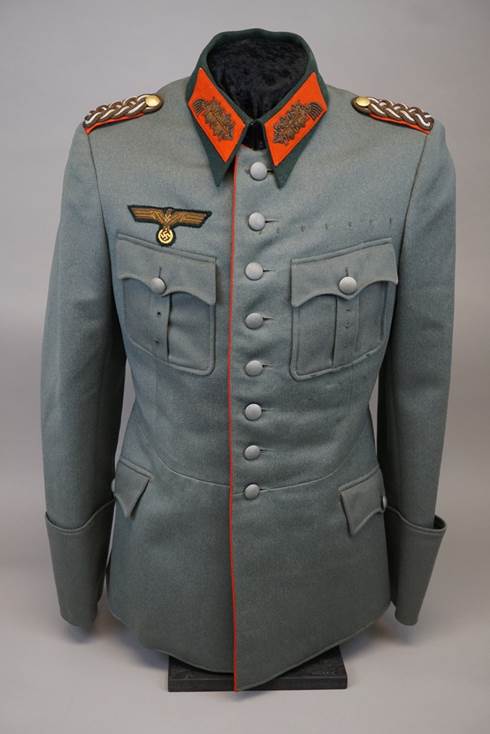 A gray military uniform with orange accents

Description automatically generated