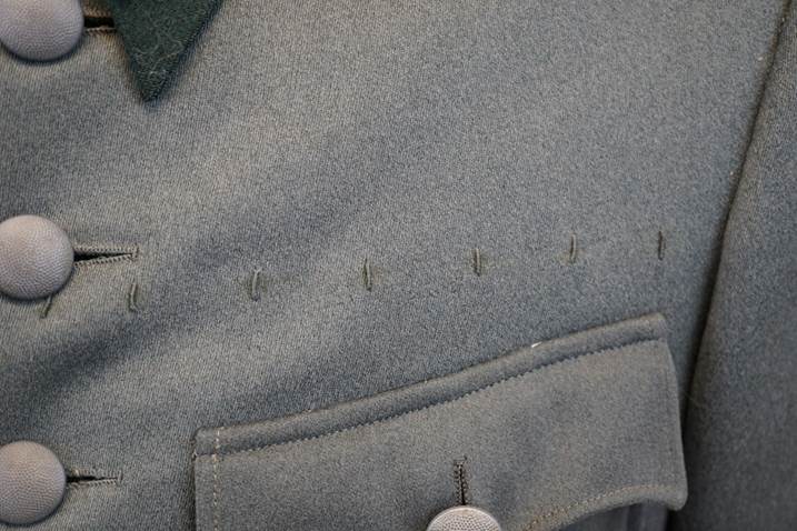 Close-up of a suit pocket

Description automatically generated