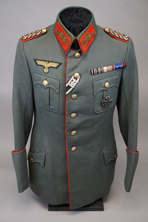 A military uniform with a badge

Description automatically generated with medium confidence