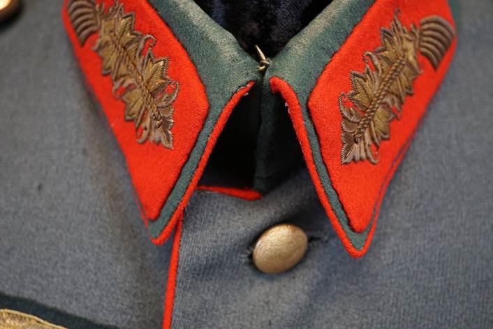 A close-up of a military uniform

Description automatically generated