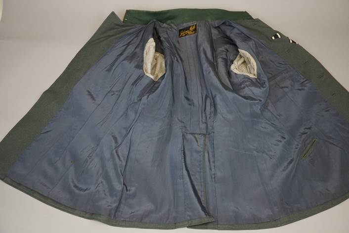 A jacket with a pocket

Description automatically generated with medium confidence