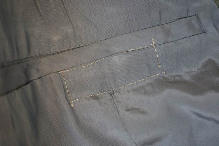 Close-up of a pocket on a piece of clothing

Description automatically generated