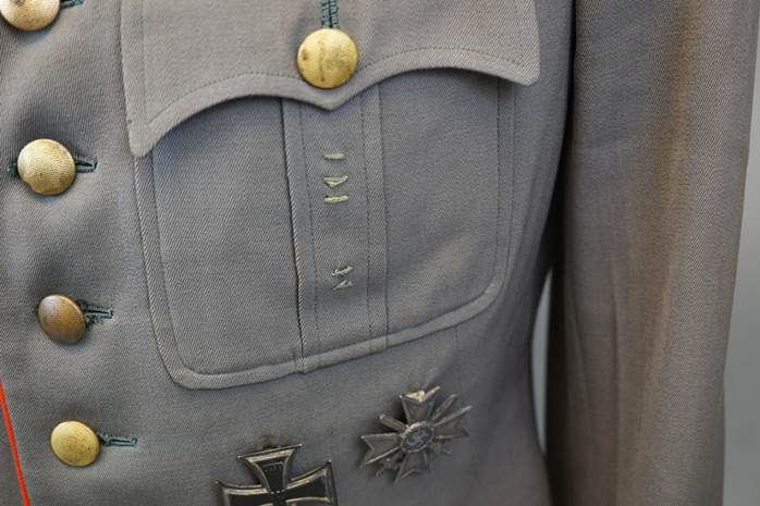 A close-up of a military uniform

Description automatically generated