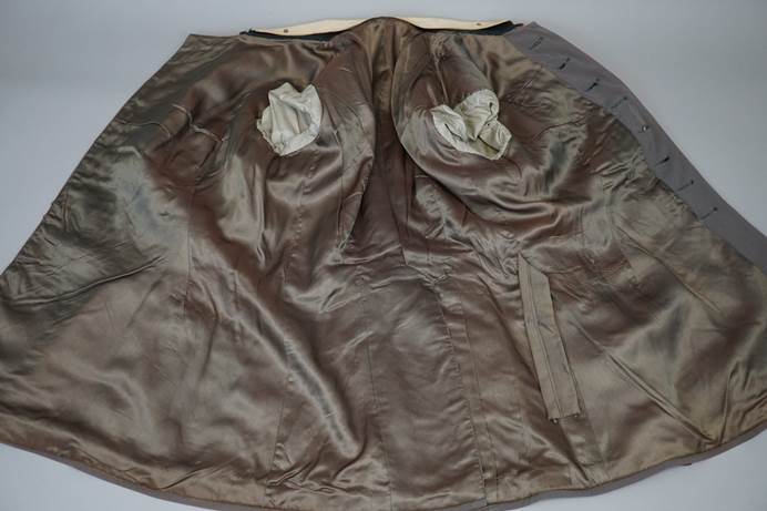 A brown skirt with holes in it

Description automatically generated