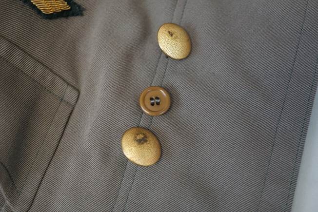 Close-up of buttons on a jacket

Description automatically generated