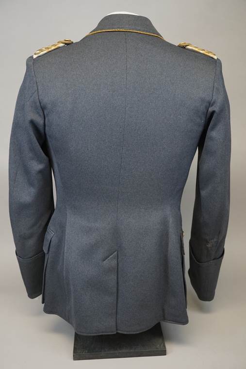 A grey jacket on a mannequin

Description automatically generated