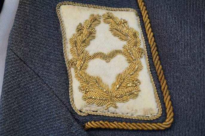 A close-up of a patch on a jacket

Description automatically generated