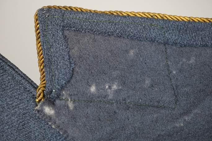 A close-up of a blue fabric

Description automatically generated