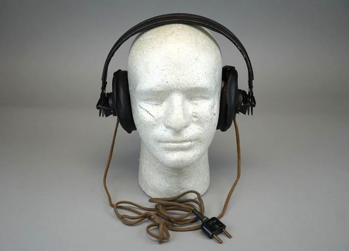 Headphones on a mannequin head

Description automatically generated