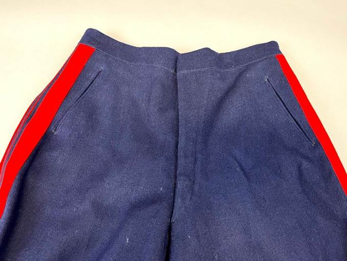 A pair of blue pants with red stripe

Description automatically generated