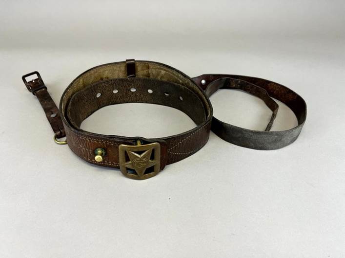 A leather belt with a buckle

Description automatically generated