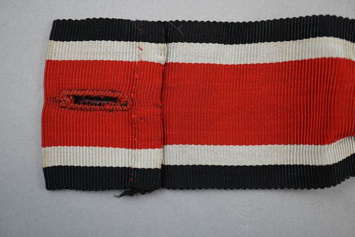 A red and black striped fabric

Description automatically generated