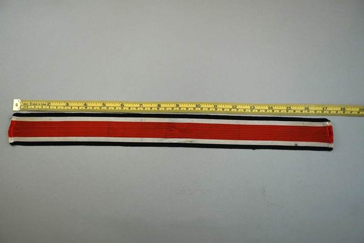 A red white and blue tape measure

Description automatically generated