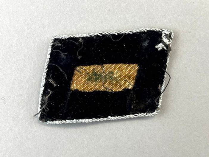 A patch with a stitched patch on it

Description automatically generated