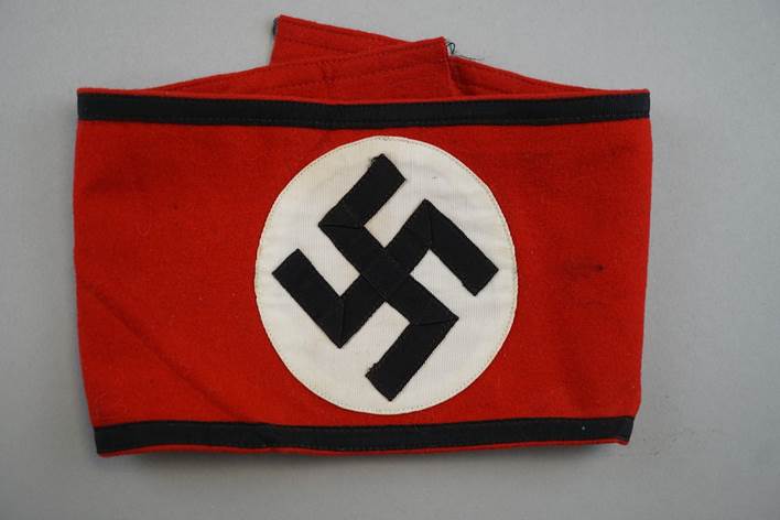 A red and black flag with a swastika

Description automatically generated