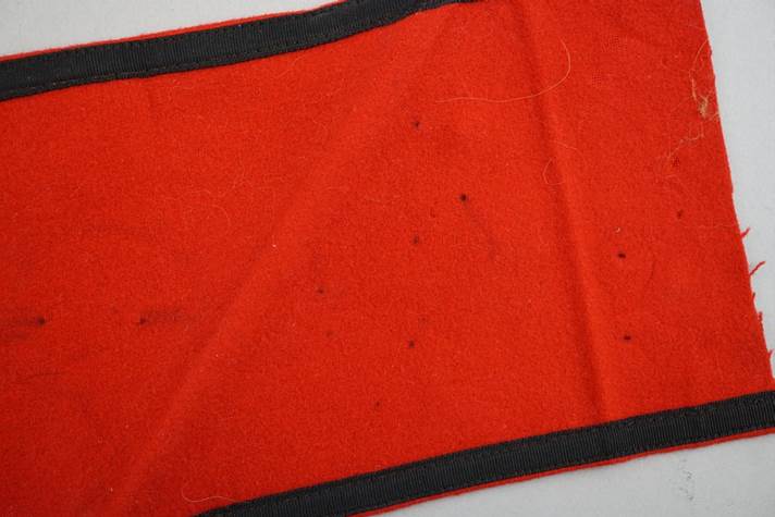 A red and black cloth

Description automatically generated