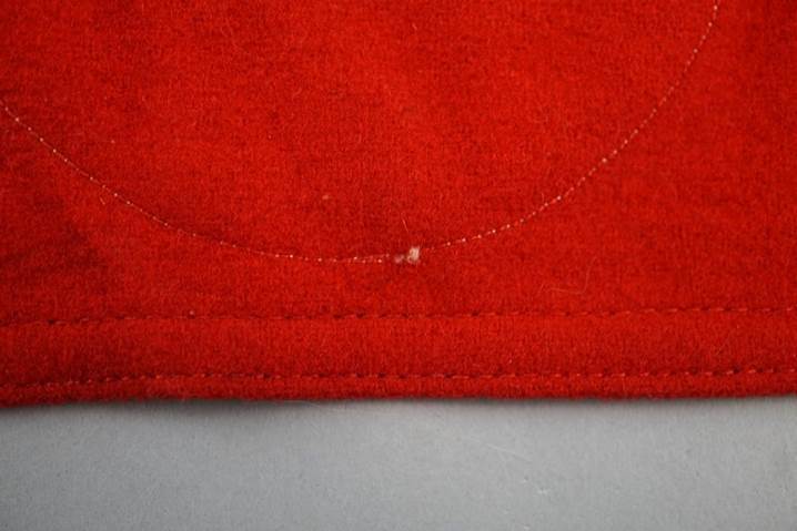 A close-up of a red fabric

Description automatically generated