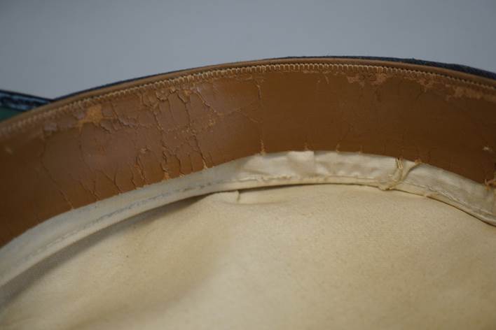 A close-up of a leather belt

Description automatically generated