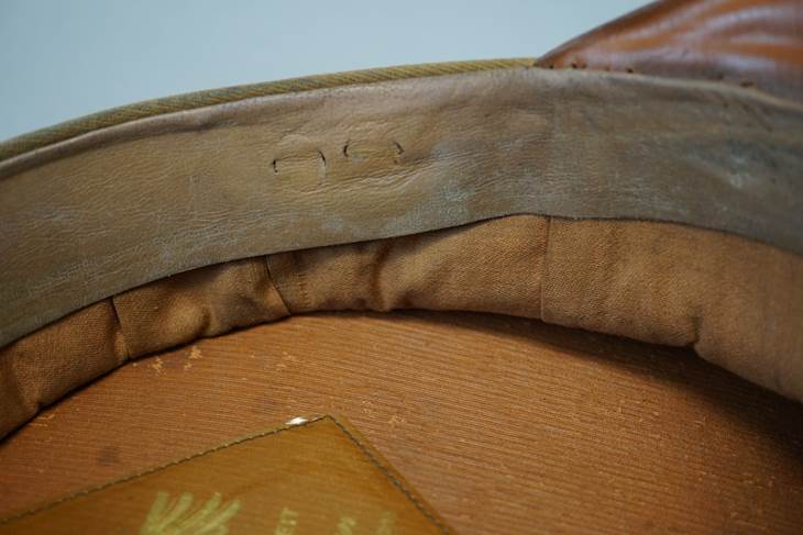 A close-up of a leather cushion

Description automatically generated