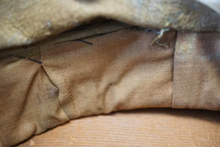 A close-up of a brown fabric

Description automatically generated