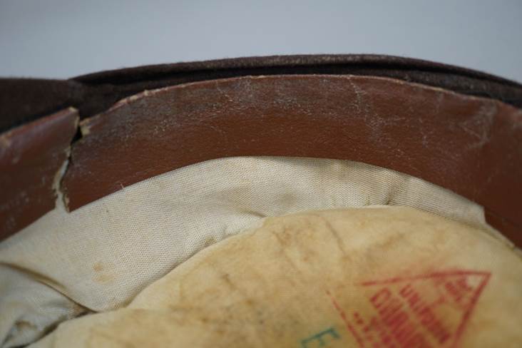 A close-up of a leather hat

Description automatically generated