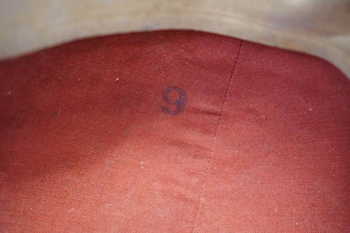 A number on a red fabric

Description automatically generated