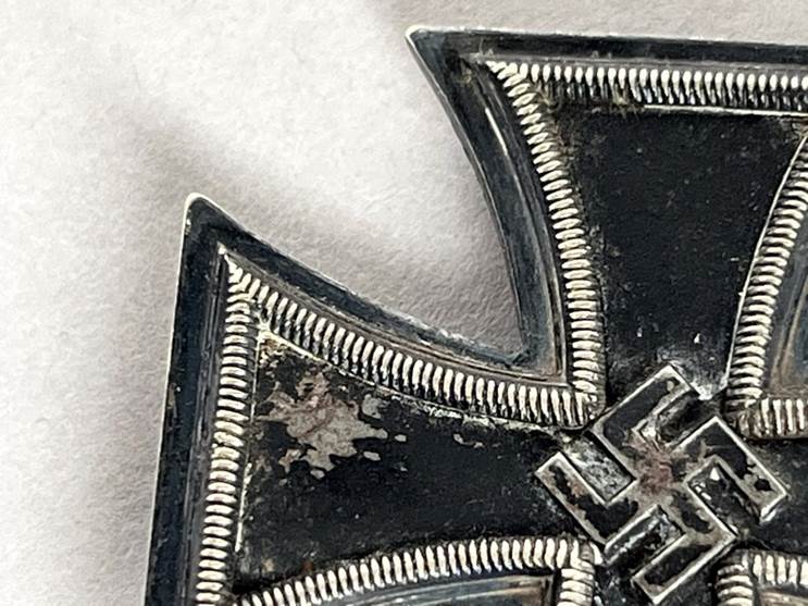 A close up of a metal cross

AI-generated content may be incorrect.