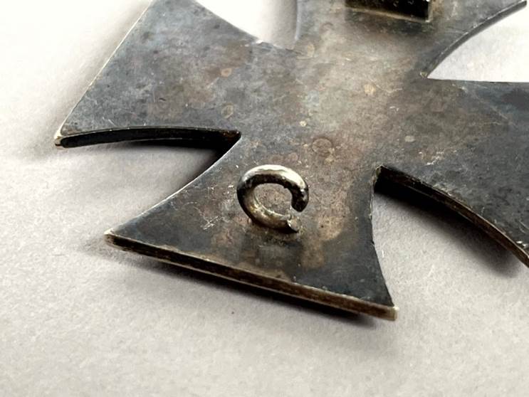 A close-up of a metal cross

AI-generated content may be incorrect.