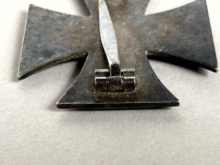 A close-up of a metal cross

AI-generated content may be incorrect.