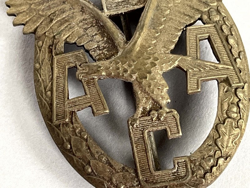 A close up of a badge

AI-generated content may be incorrect.