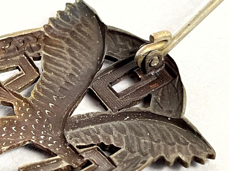 A close-up of a metal eagle

AI-generated content may be incorrect.