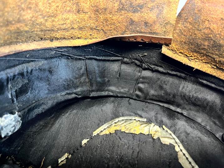 A close up of a black hat

AI-generated content may be incorrect.
