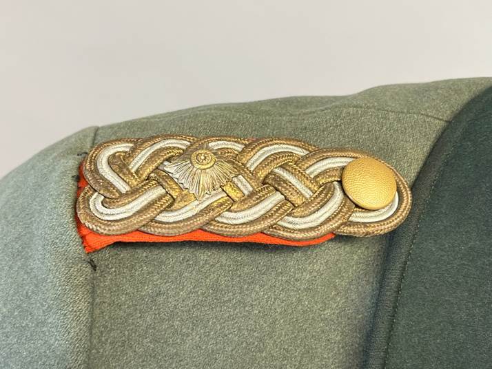 A close up of a military uniform

AI-generated content may be incorrect.