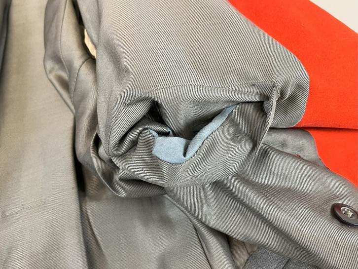 A close up of a folded grey fabric

AI-generated content may be incorrect.