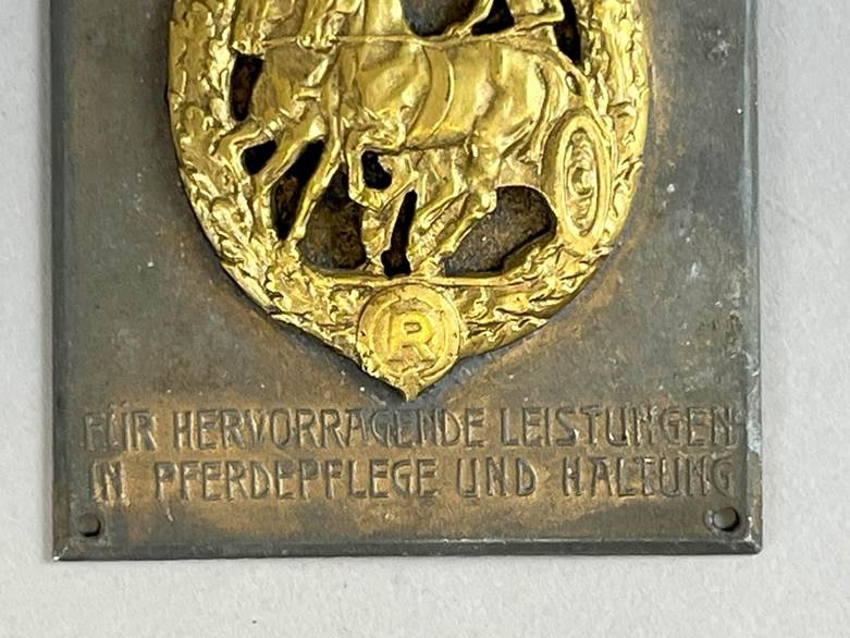 A plaque with a horse and rider on it

AI-generated content may be incorrect.