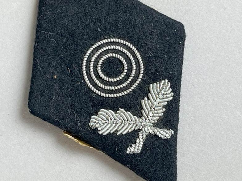 A black patch with silver beads

AI-generated content may be incorrect.