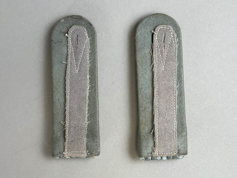 A pair of grey leather straps

AI-generated content may be incorrect.