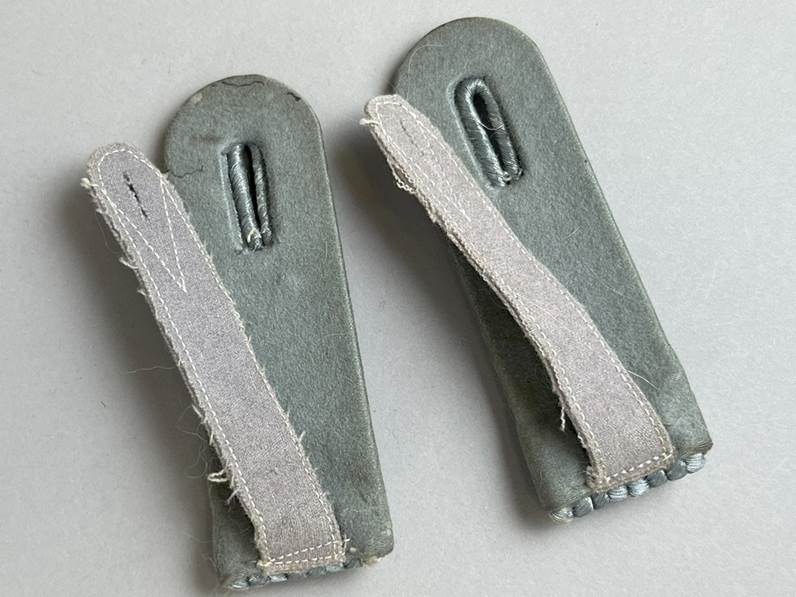 A pair of grey leather straps

AI-generated content may be incorrect.