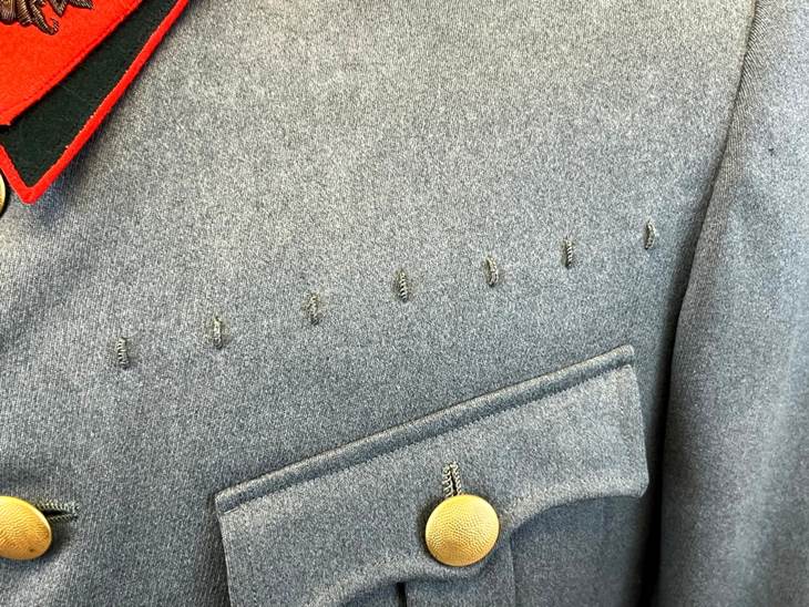 A close up of a uniform

AI-generated content may be incorrect.