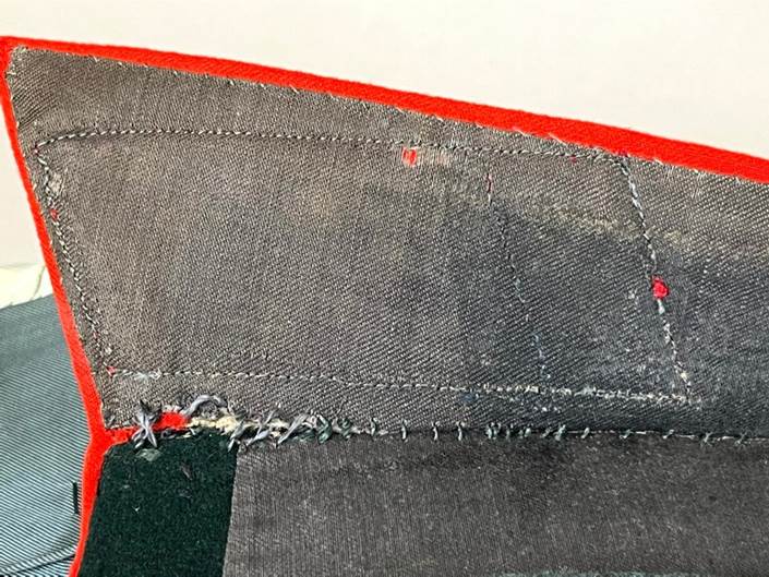 A patchwork of fabric with red trim

AI-generated content may be incorrect.