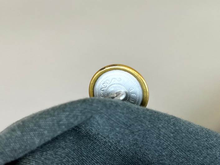 A close-up of a button

AI-generated content may be incorrect.