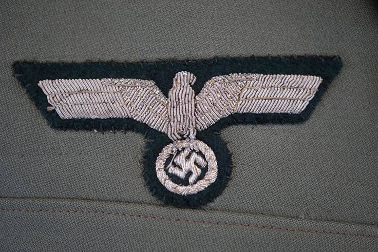 A close-up of a military uniform

AI-generated content may be incorrect.