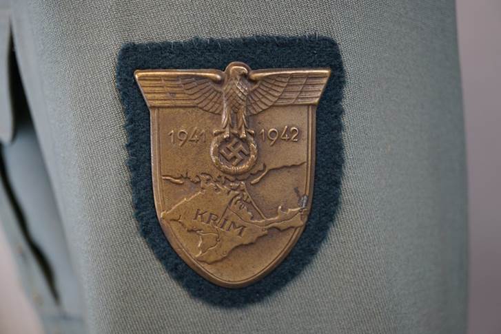 A close-up of a badge

AI-generated content may be incorrect.