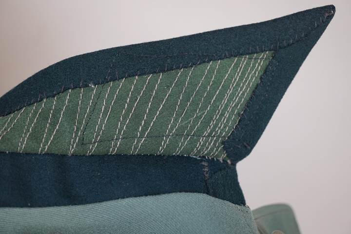 Close-up of a green and blue fabric

AI-generated content may be incorrect.