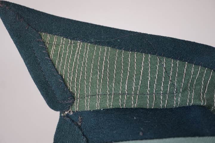 A close-up of a green and blue fabric

AI-generated content may be incorrect.