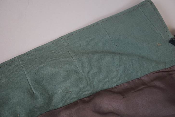 A close-up of a green fabric

AI-generated content may be incorrect.