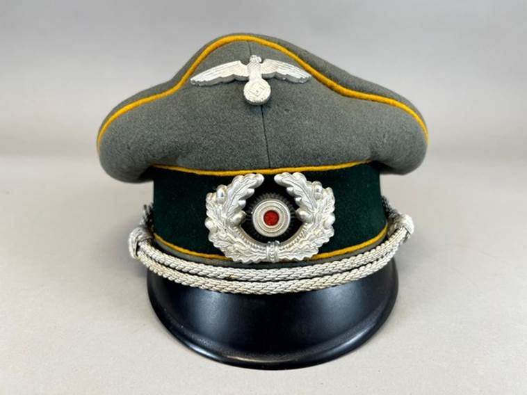 A hat with a white and silver decoration

AI-generated content may be incorrect.