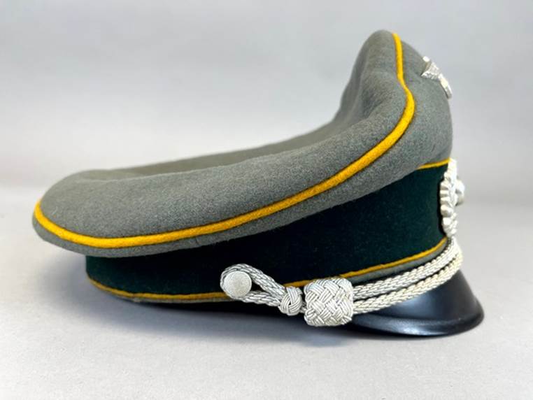 A military hat with a yellow stripe

AI-generated content may be incorrect.
