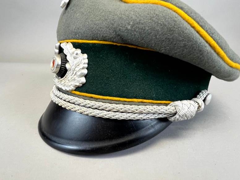 A hat with a white rope

AI-generated content may be incorrect.