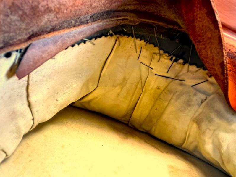 A close up of a leather seat

AI-generated content may be incorrect.
